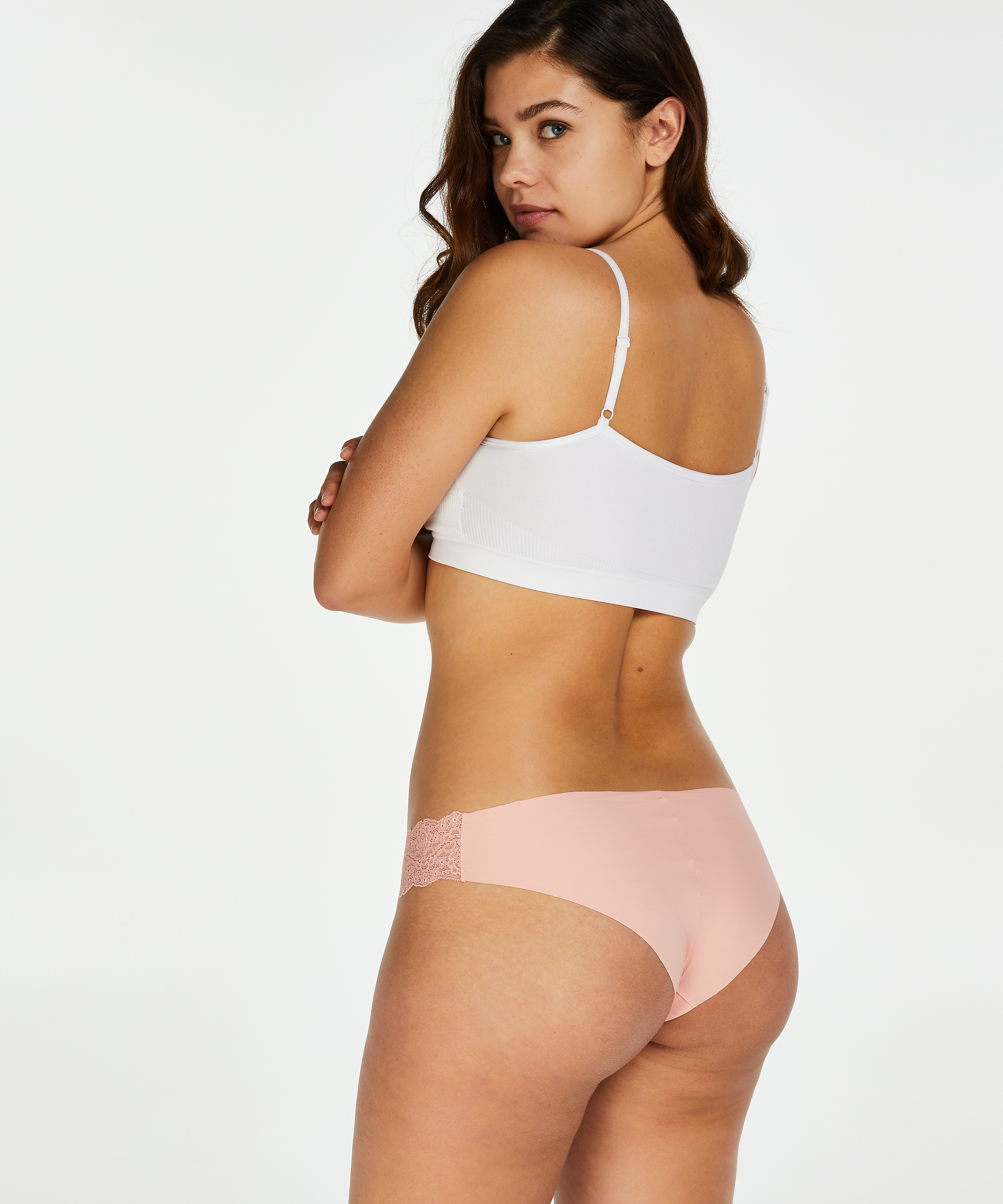 Slip brésilien Invisible Dentelle, Rose, main